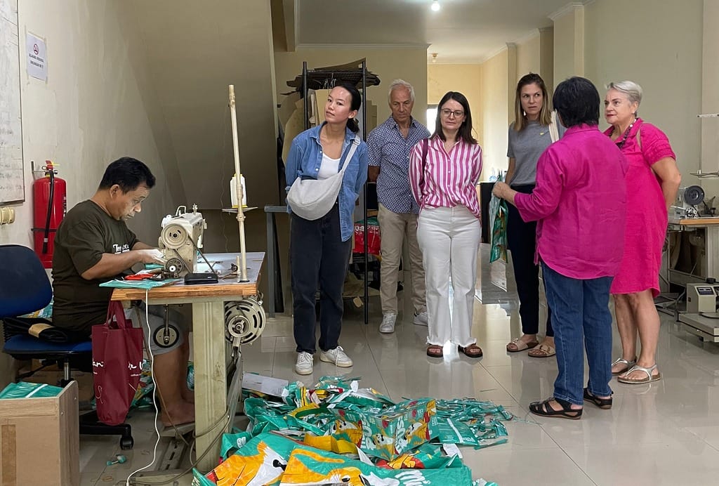 xsprojek visit tour program participants are looking at the production process of products being worked on by tailors