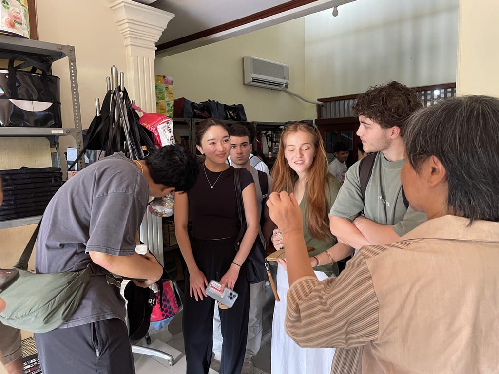 Students from the Business School - University of Sydney are listening to information from Retno, director of XSProjek.